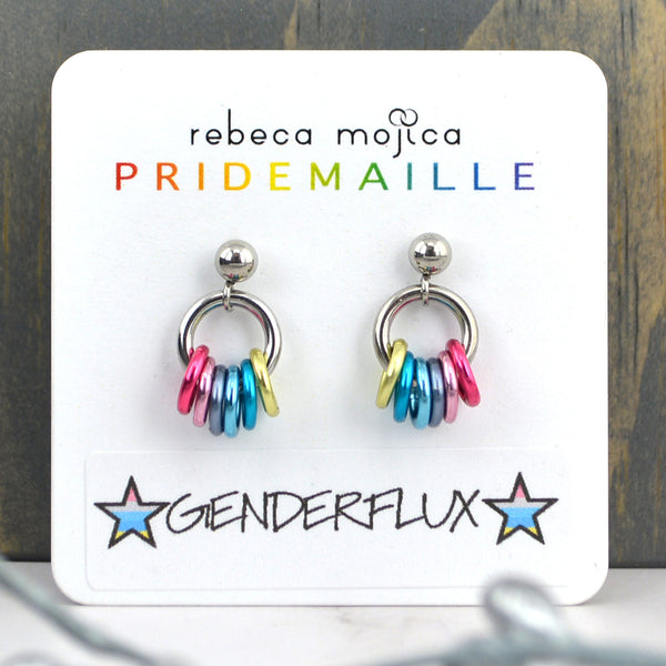 Small lgbtq genderflux pride chainmaille stud earrings on a white card. Each earring has a stainless steel ball with a steel link and 7 smaller links in the colors of the genderflux pride flag - 2 shades of pink, grey, 2 shades of blue and light yellow