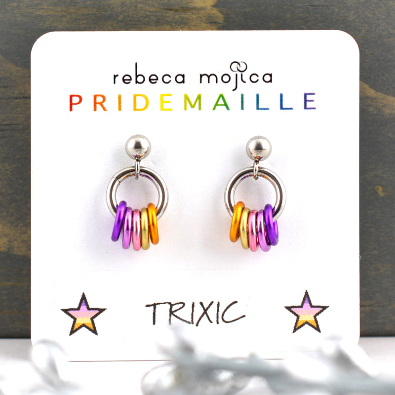 Small lgbtq trixic pride chainmaille stud earrings on a white card. Each earring has a stainless steel ball with a steel link and 5 smaller links in the colors of the trixic pride flag - violet, orchid, pink, light yellow and orange